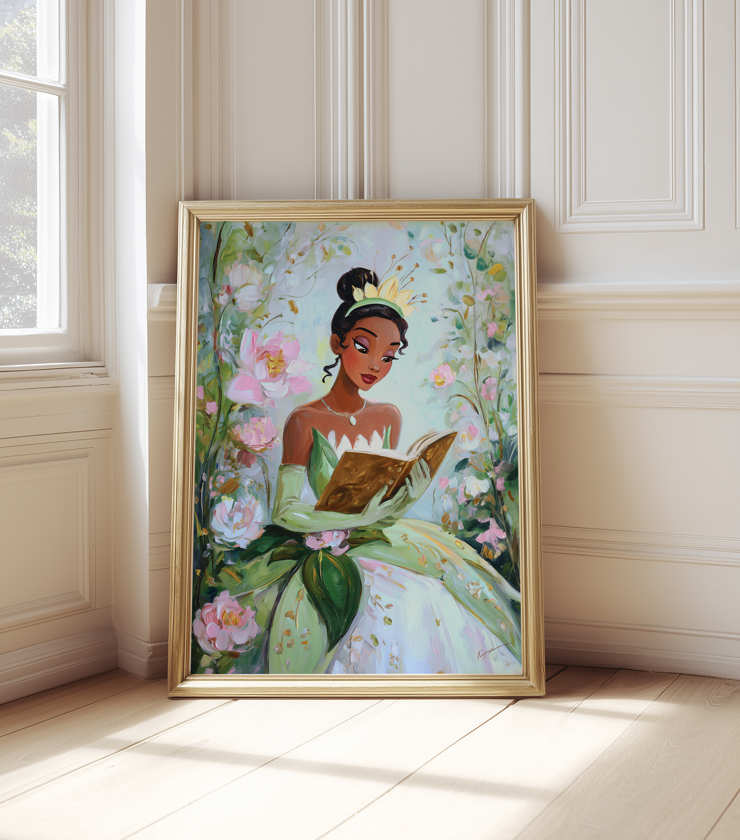 Framed artwork of a woman in a green dress reading a book, surrounded by flowers, on a white wall.