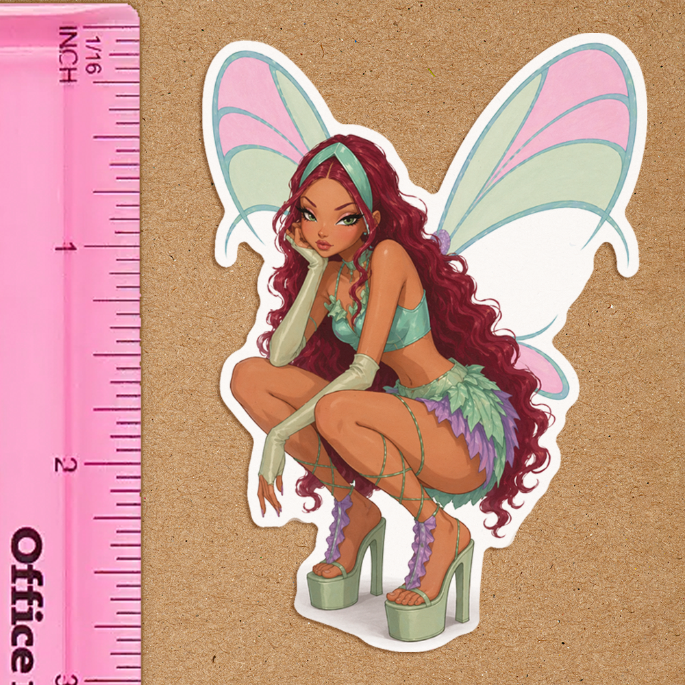 Cartoon fairy character with pink and green wings sitting on a brown surface next to a pink ruler.