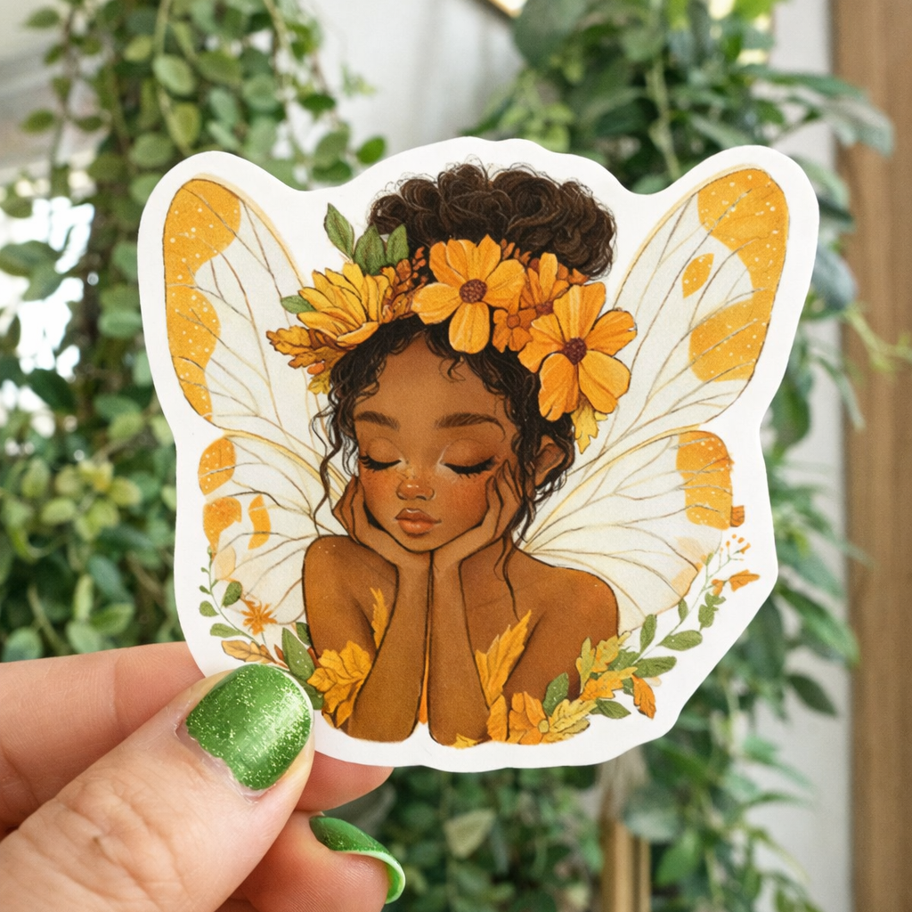 Sticker of a woman with butterfly wings and flowers held in front of green plants.
