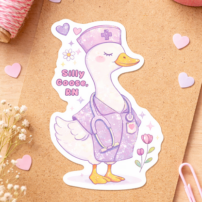 Sticker of a duck in a nurse outfit on a kraft paper background with flowers and tape.